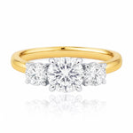 Gold ring with three diamond stones on a white background at LeGassick