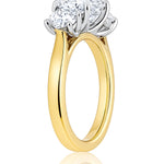 Gold ring with three diamond stones on a white background at LeGassick