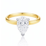 Gold ring with a pear-shaped lab grown diamond on a white background at LeGassick.