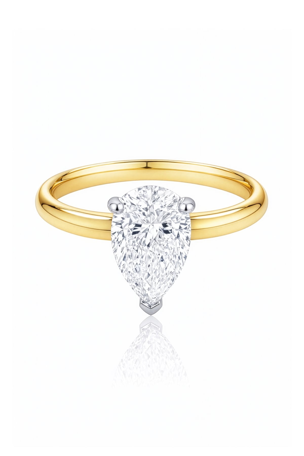 Gold ring with a pear-shaped lab grown diamond on a white background at LeGassick.