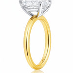 Gold ring with a pear-shaped lab grown diamond on a white background at LeGassick.