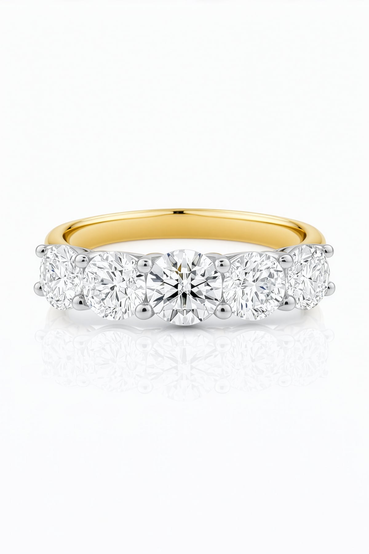 Gold ring with five lab created diamonds on a white background at LeGassick, Gold Coast, Australia.