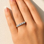 Gold ring with five lab created diamonds on a lady's hand at LeGassick, Gold Coast, Australia.