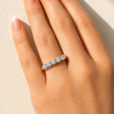 Gold ring with five lab created diamonds on a lady's hand at LeGassick, Gold Coast, Australia.