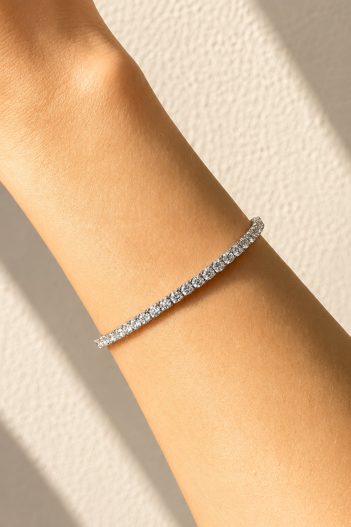 Lab grown diamond tennis bracelet in white gold on a lady's wrist at LeGassick, Gold Coast, Australia.