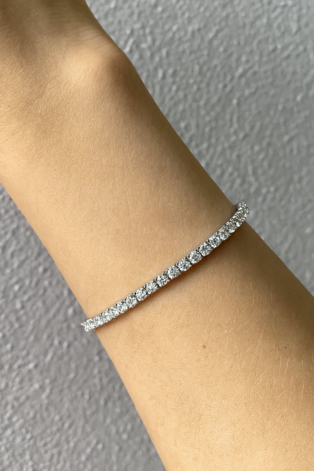 Lab grown diamond tennis bracelet in white gold on a lady's wrist at LeGassick, Gold Coast, Australia.
