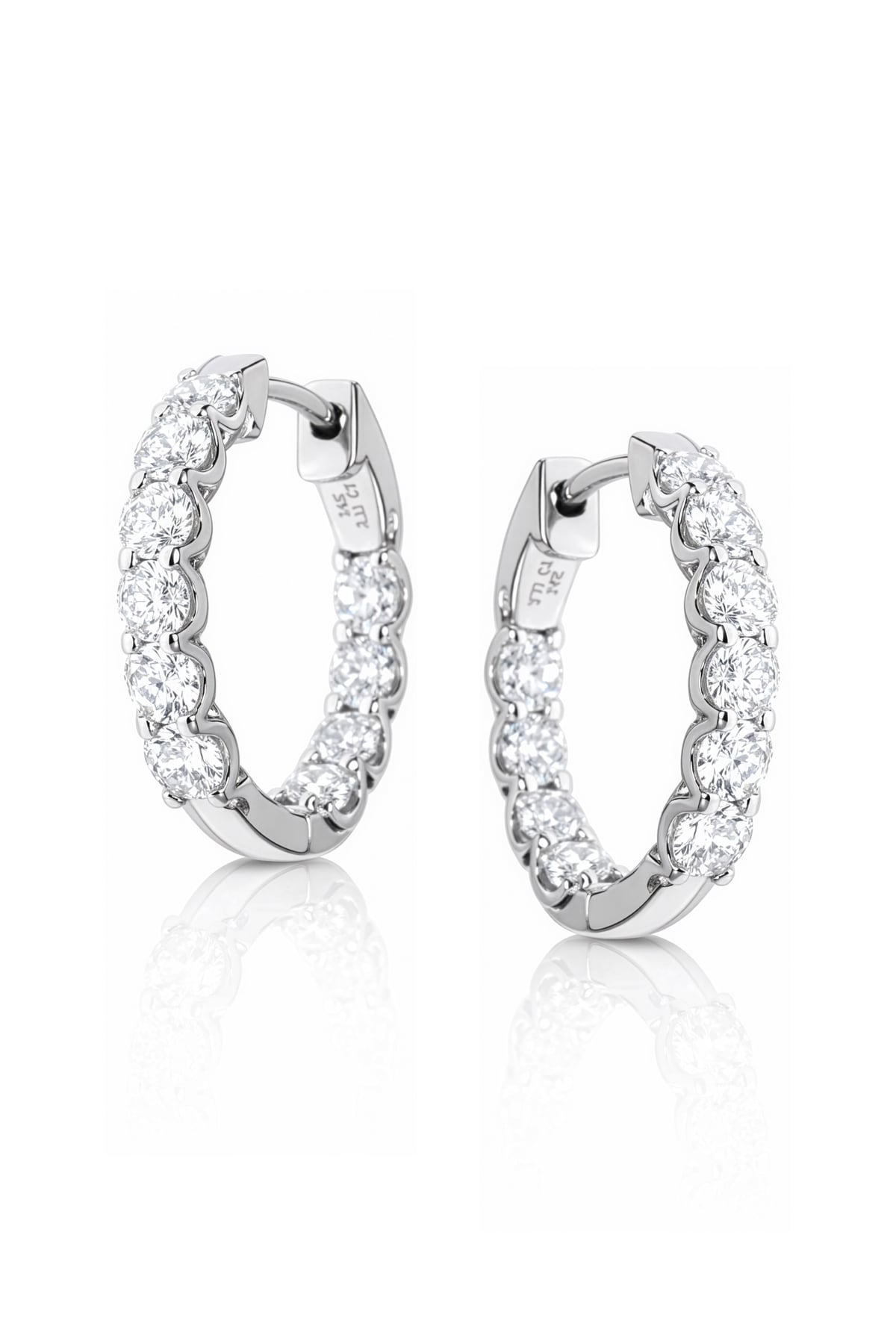 Pair of white gold hoop earrings with clear lab grown diamonds on a white background