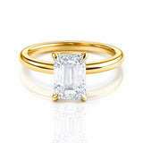 Gold ring with a large lab grown emerald cut diamond on a white background at LeGassick, Gold Coast, Australia.