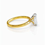 Gold ring with a large lab grown emerald cut diamond on a white background at LeGassick, Gold Coast, Australia.