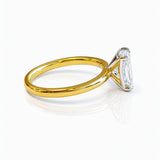 Gold ring with a large lab grown emerald cut diamond on a white background at LeGassick, Gold Coast, Australia.