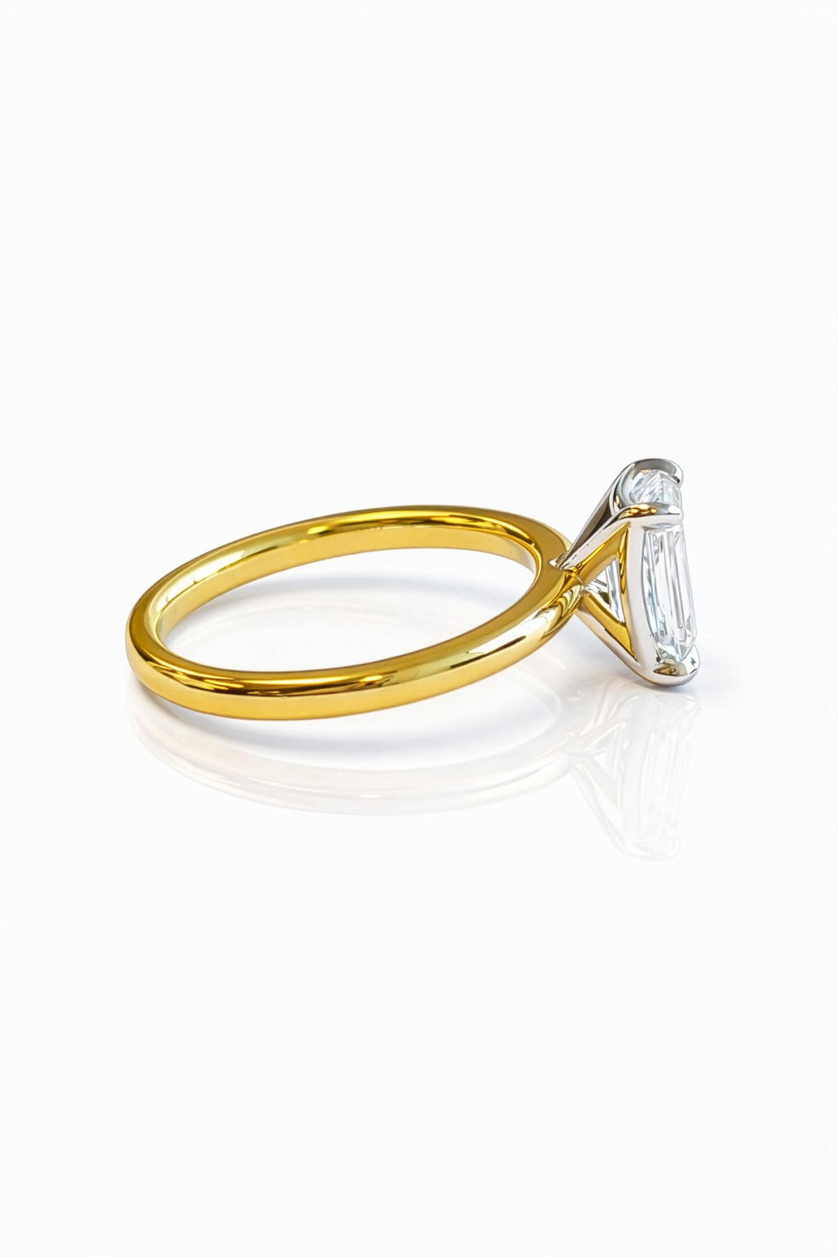 Gold ring with a large lab grown emerald cut diamond on a white background at LeGassick, Gold Coast, Australia.