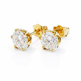 Gold lab diamond stud earrings on a white background