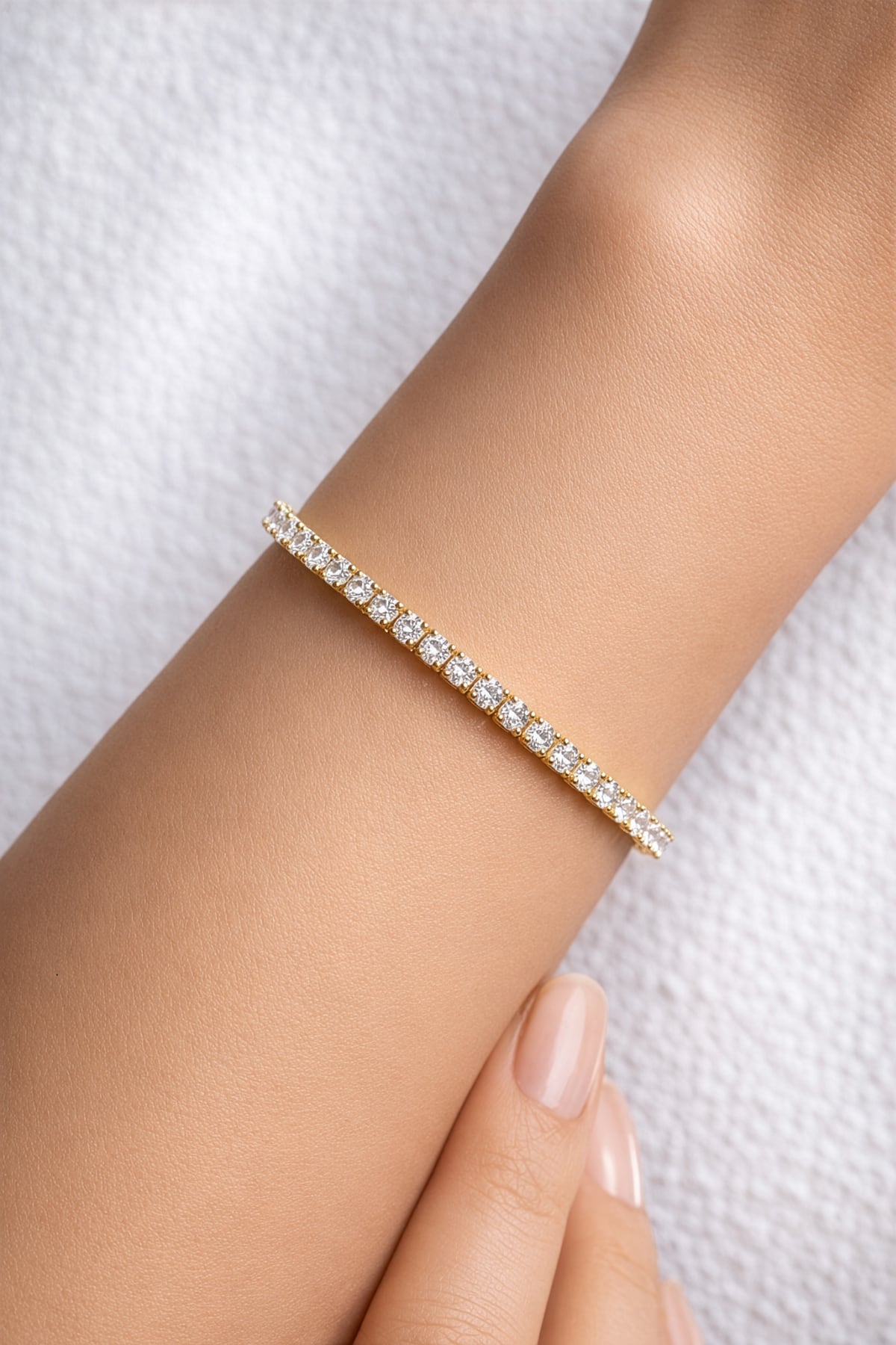 Yellow gold lab grown diamond tennis bracelet on a woman's wrist at LeGassick, Gold Coast, Australia.