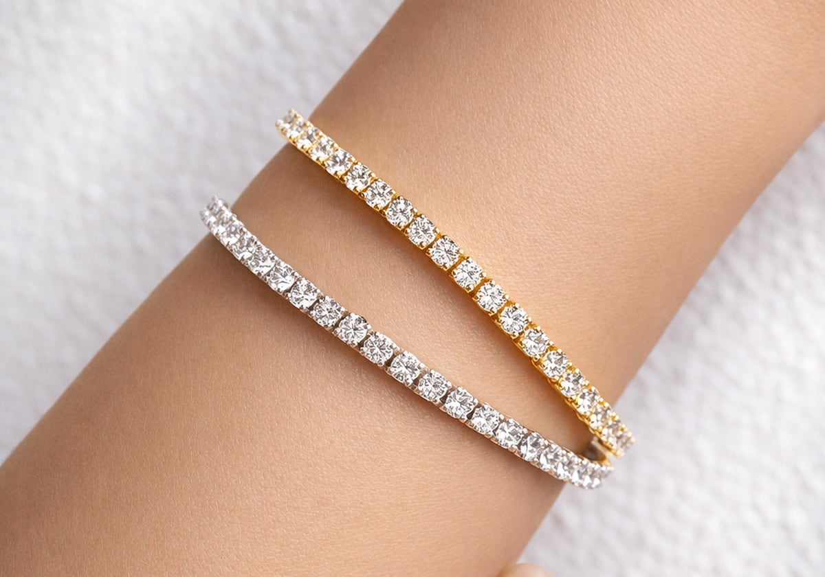 Yellow and white gold lab grown diamond tennis bracelets on a woman's wrist at LeGassick, Gold Coast, Australia.