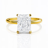 Gold ring with a large lab diamond on a white background at LeGassick.