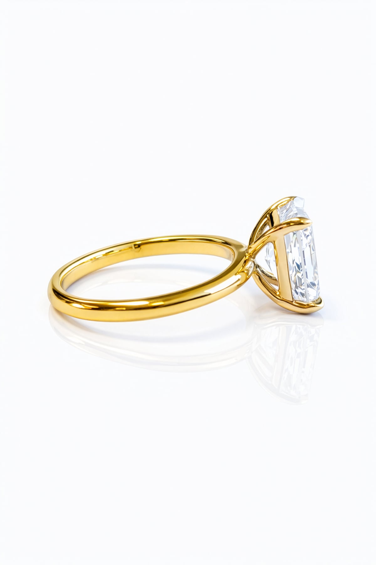 Gold ring with a large lab diamond on a white background at LeGassick.