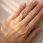 Gold ring with a lab diamond on a hand against a neutral background at LeGassick.
