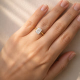 Gold ring with a lab diamond on a hand against a neutral background at LeGassick.