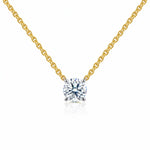 Gold necklace with a lab grown diamond pendant on a white background
