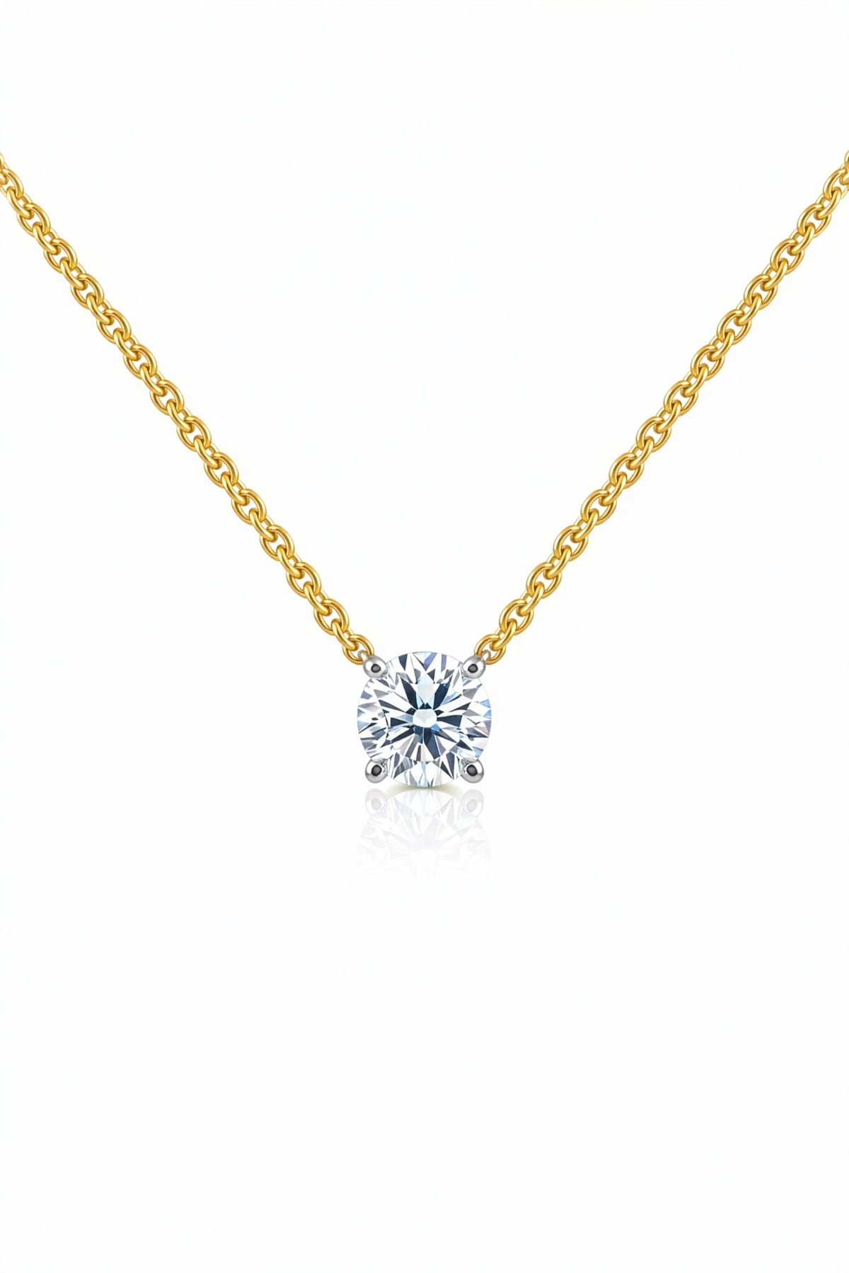 Gold necklace with a lab grown diamond pendant on a white background