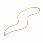 Gold necklace with a lab grown diamond pendant on a white background