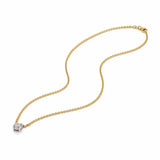 Gold necklace with a lab grown diamond pendant on a white background