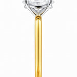 Gold ring with a lab grown diamond on a white background at LeGassick.