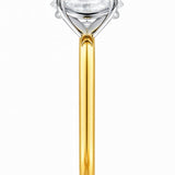 Gold ring with a lab grown diamond on a white background at LeGassick.
