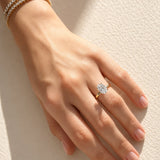 Hand wearing a lab diamond ring on a soft fabric background at LeGassick.