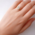 Gold ring with a rectangular diamond on a lady's hand at LeGassick Gold Coast, Australia.