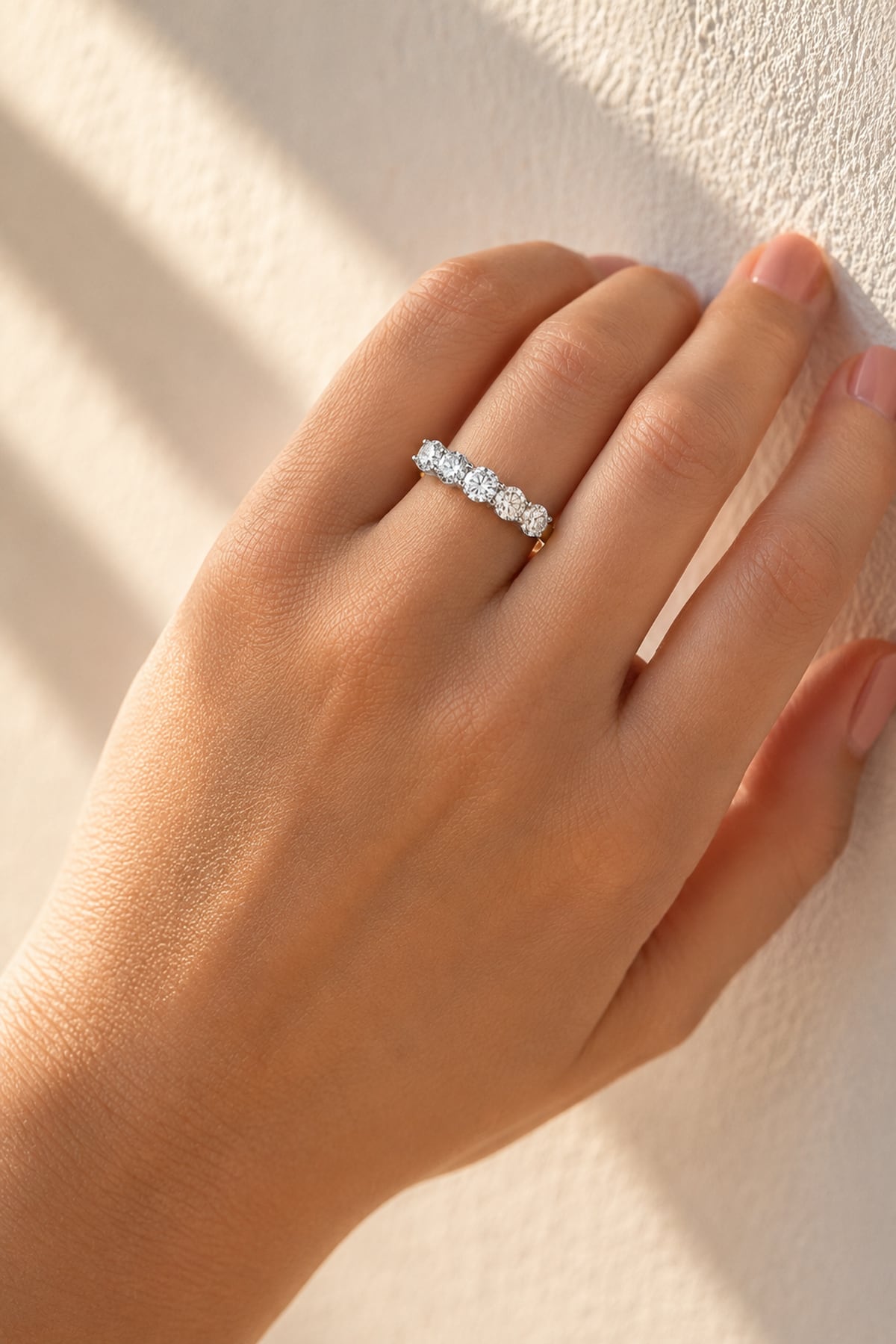 Gold ring with 5 lab grown diamonds on a lady's hand at LeGassick, Gold Coast, Australia.