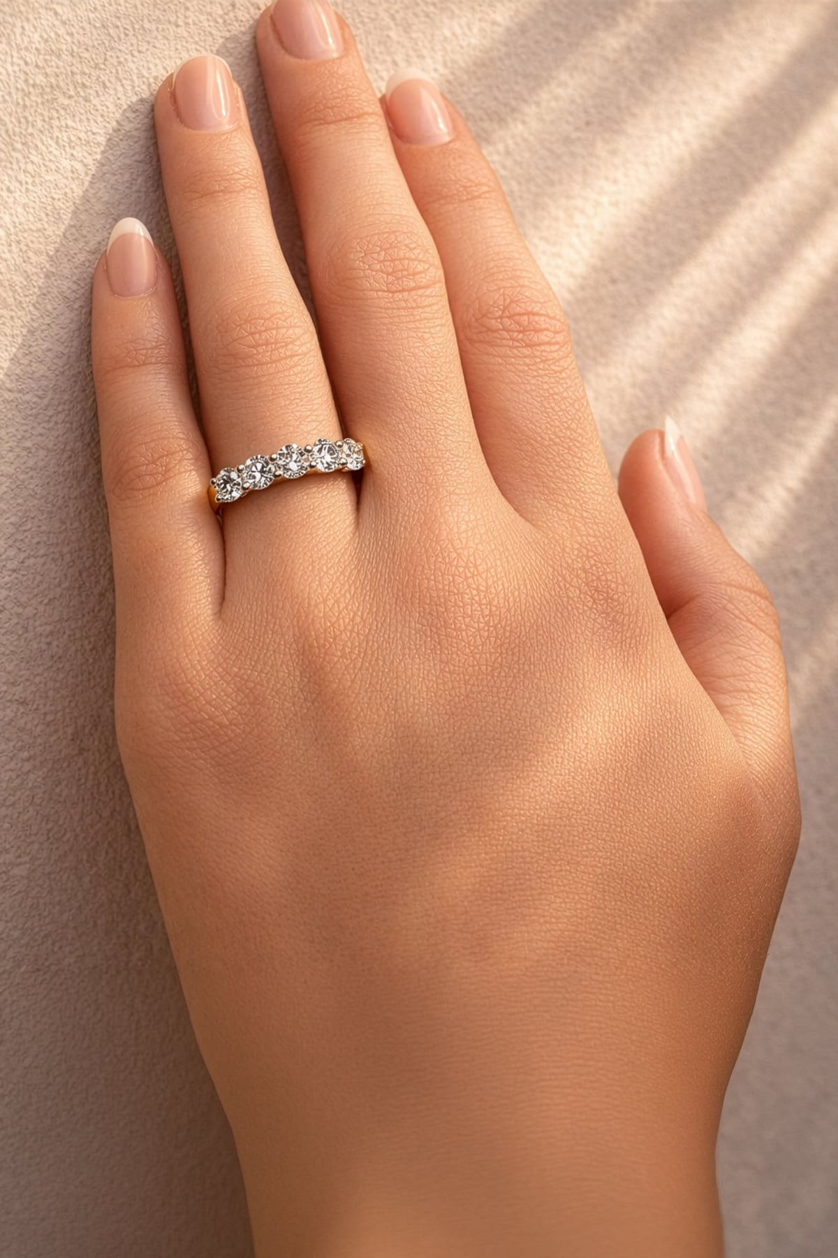 Gold ring with 5 lab grown diamonds on a lady's hand at LeGassick, Gold Coast, Australia.
