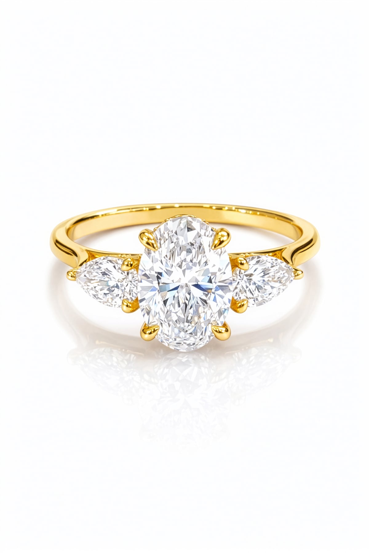 Gold ring with a large lab grown diamond and smaller diamonds on a white background