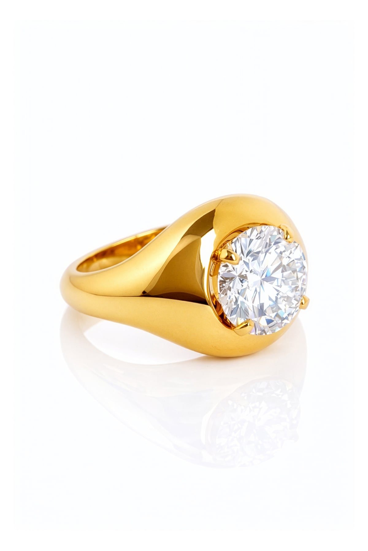 Gold ring with a large lab grown diamond on a white background