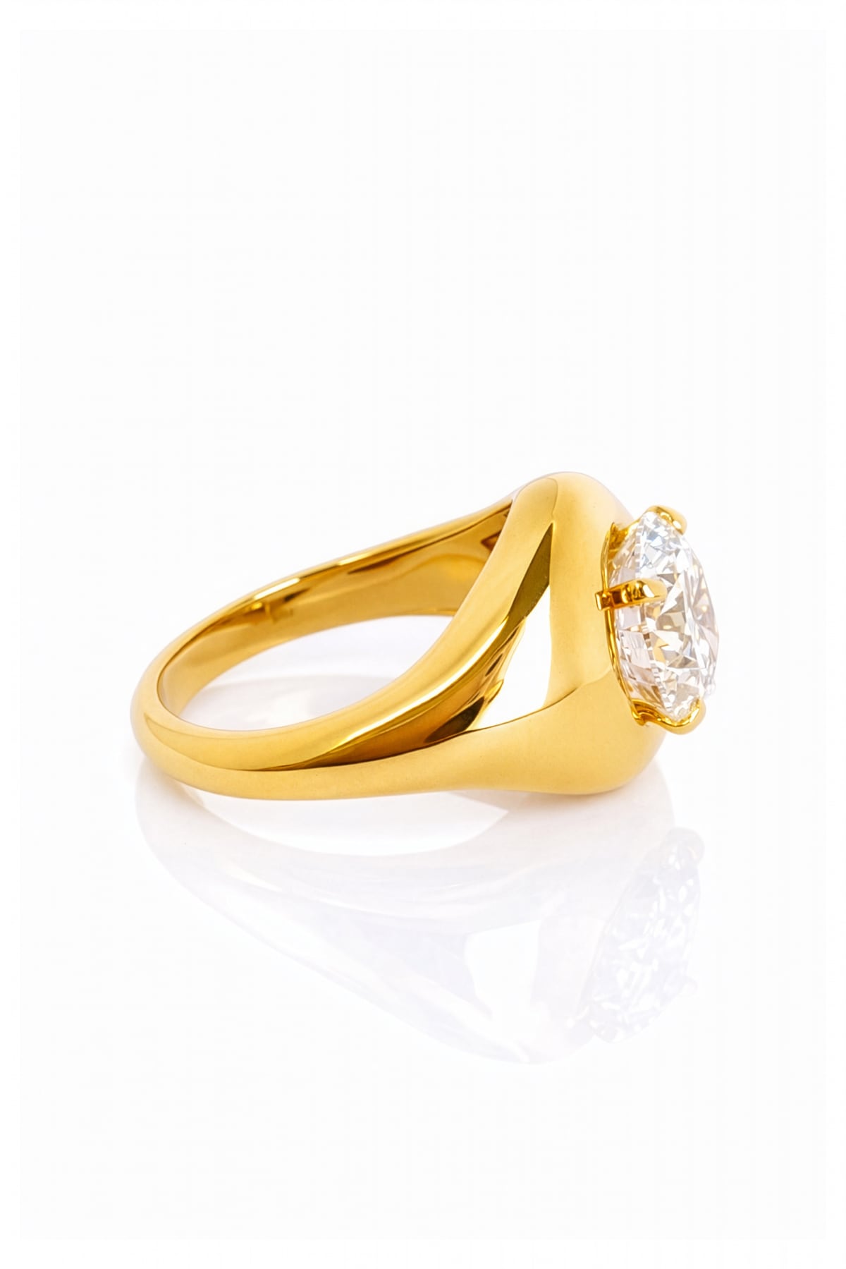 Gold ring with a large lab grown diamond on a white background