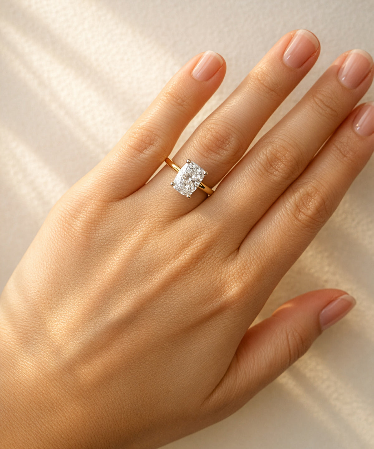 Gold ring with a large diamond on a lady's hand at LeGassick, Gold Coast, Australia.