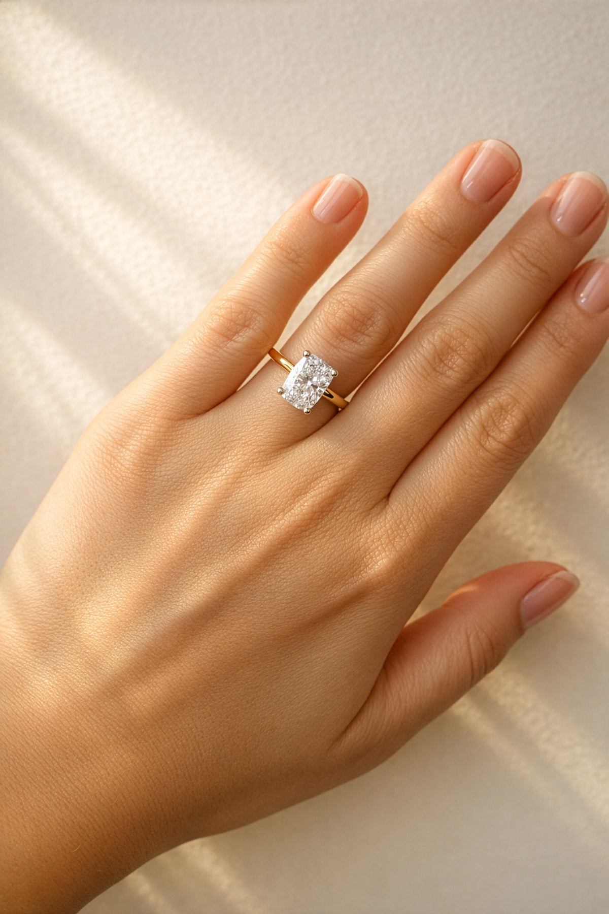 Gold ring with a large diamond on a lady's hand at LeGassick, Gold Coast, Australia.