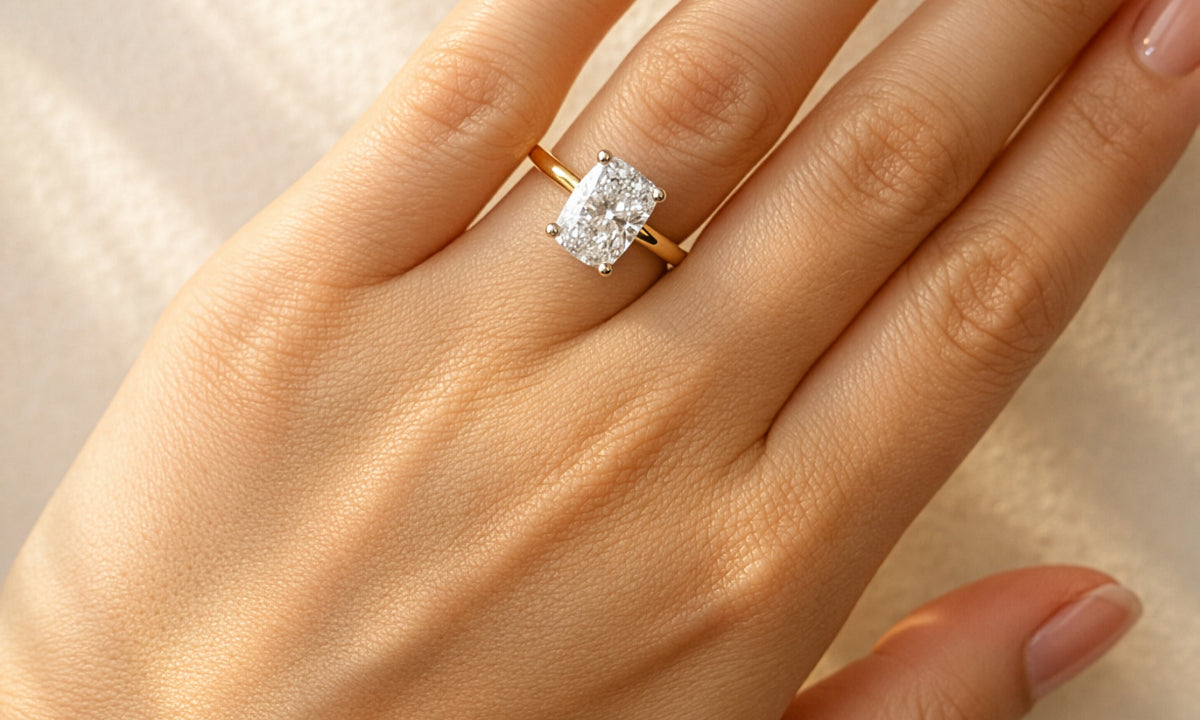 Gold ring with a large diamond on a lady's hand at LeGassick, Gold Coast, Australia.