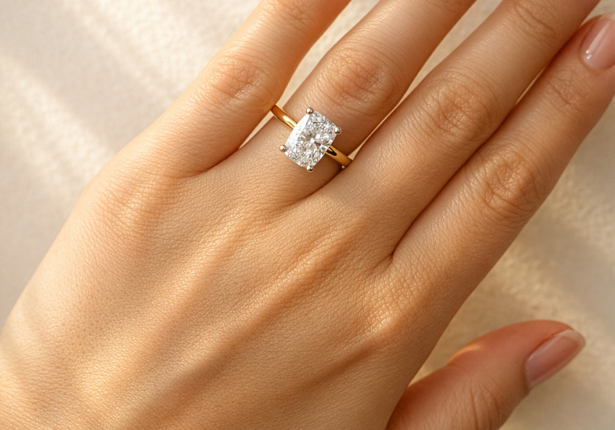 Gold ring with a large diamond on a lady's hand at LeGassick, Gold Coast, Australia.