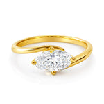 Gold ring with a lab grown diamond on a white background at LeGassick.