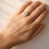 Hand wearing a lab diamond ring on a light background at LeGassick.