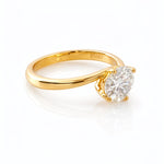 Gold ring with a lab grown diamond on a white background at LeGassick.