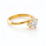 Gold ring with a lab grown diamond on a white background at LeGassick.