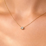 Gold necklace with a lab grown diamond pendant on a person's neck, at LeGassick, Gold Coast, Australia.