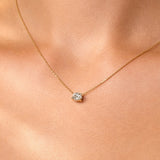 Gold necklace with a lab grown diamond pendant on a person's neck, at LeGassick, Gold Coast, Australia.