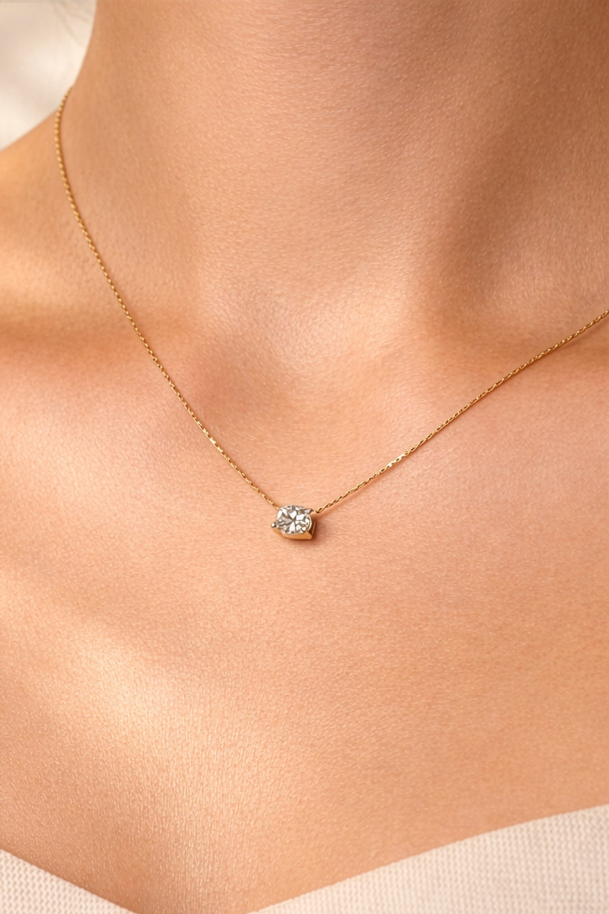 Gold necklace with a lab grown diamond pendant on a person's neck, at LeGassick, Gold Coast, Australia.