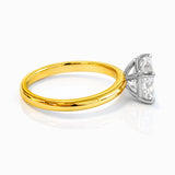 Gold ring with a rectangular lab grown diamond on a white background