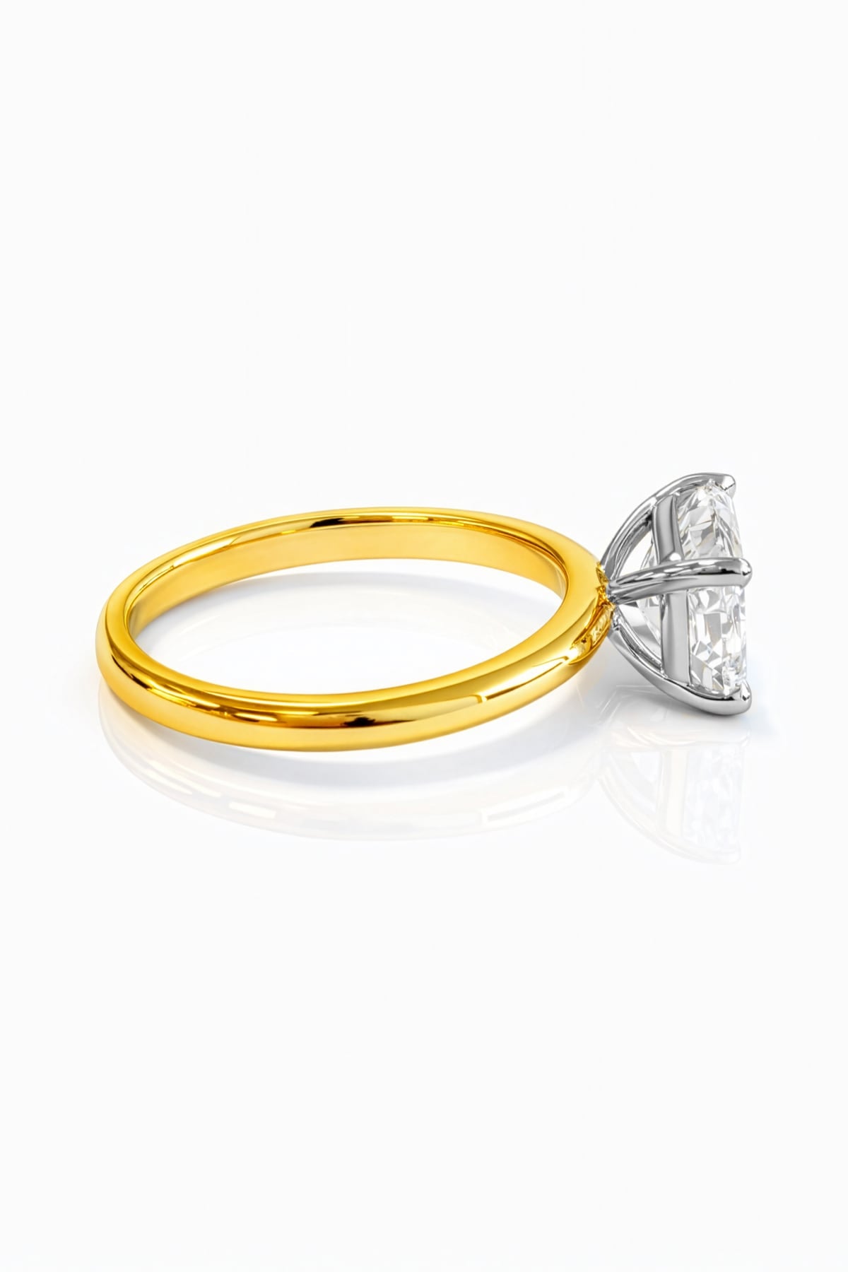Gold ring with a rectangular lab grown diamond on a white background
