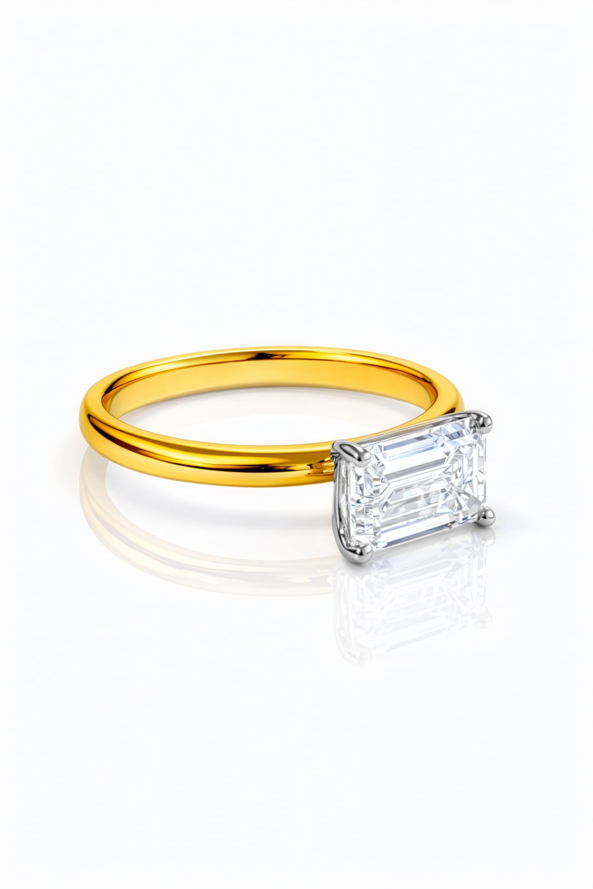 Gold ring with a rectangular lab grown diamond on a white background