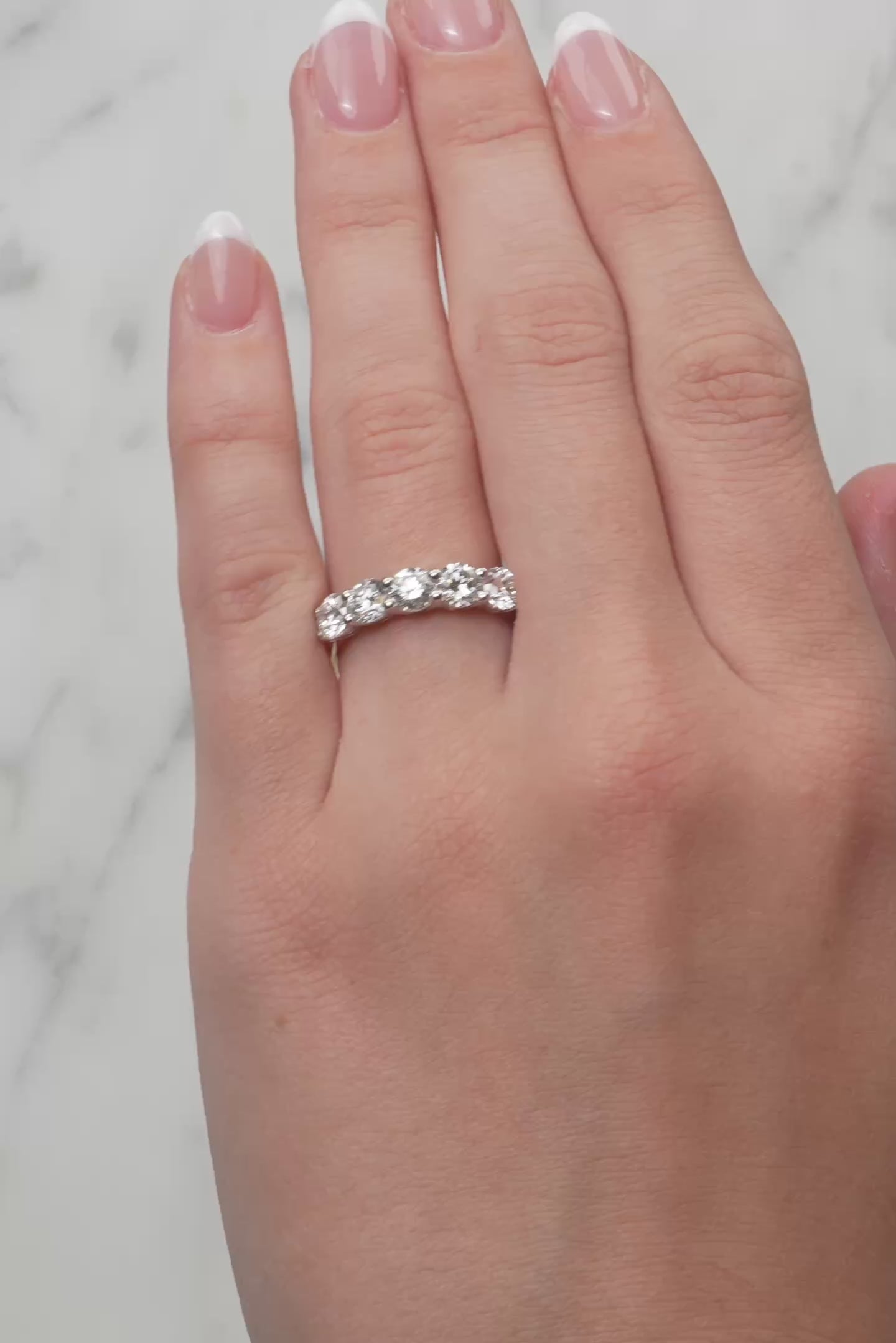 Gold ring with 5 lab grown diamonds on a lady's hand at LeGassick, Gold Coast, Australia.